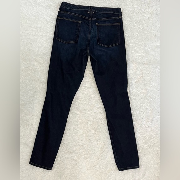 Good American Side Zip Skinny Jeans in a dark wash - Picture 2 of 7